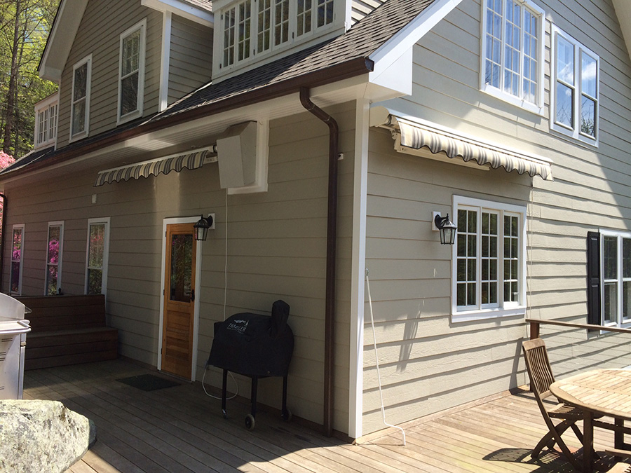 awnings on tan home