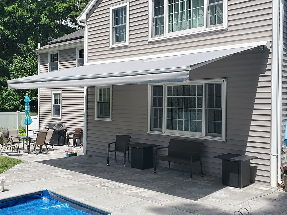retractable awning on tan house