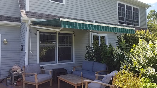 green striped retractable awning