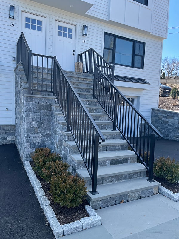 railing installed over a stone staircase
