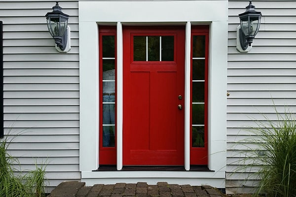bright red entry door with side panels