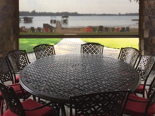 patio table with chairs under retractable awning