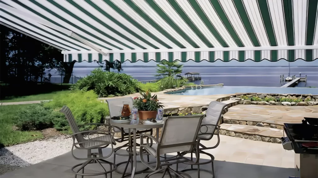 white and green striped retractable awning over a patio in Connecticut