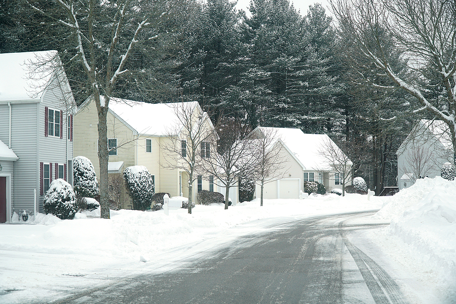 houses in residential community after snow in winter