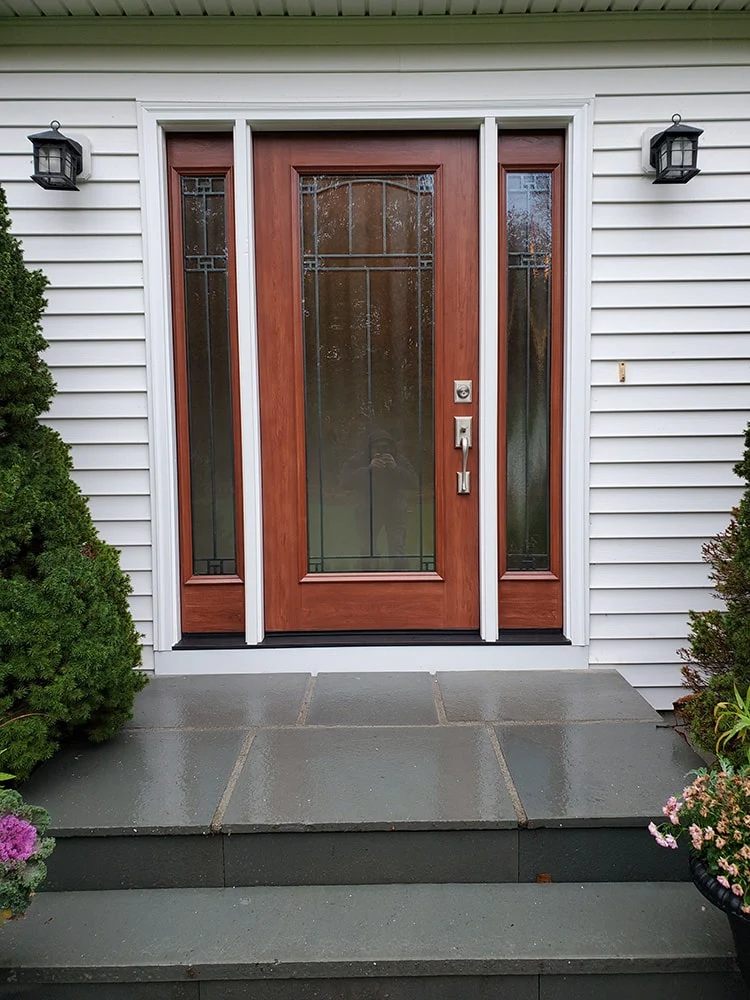 red entry door with full glass side panels