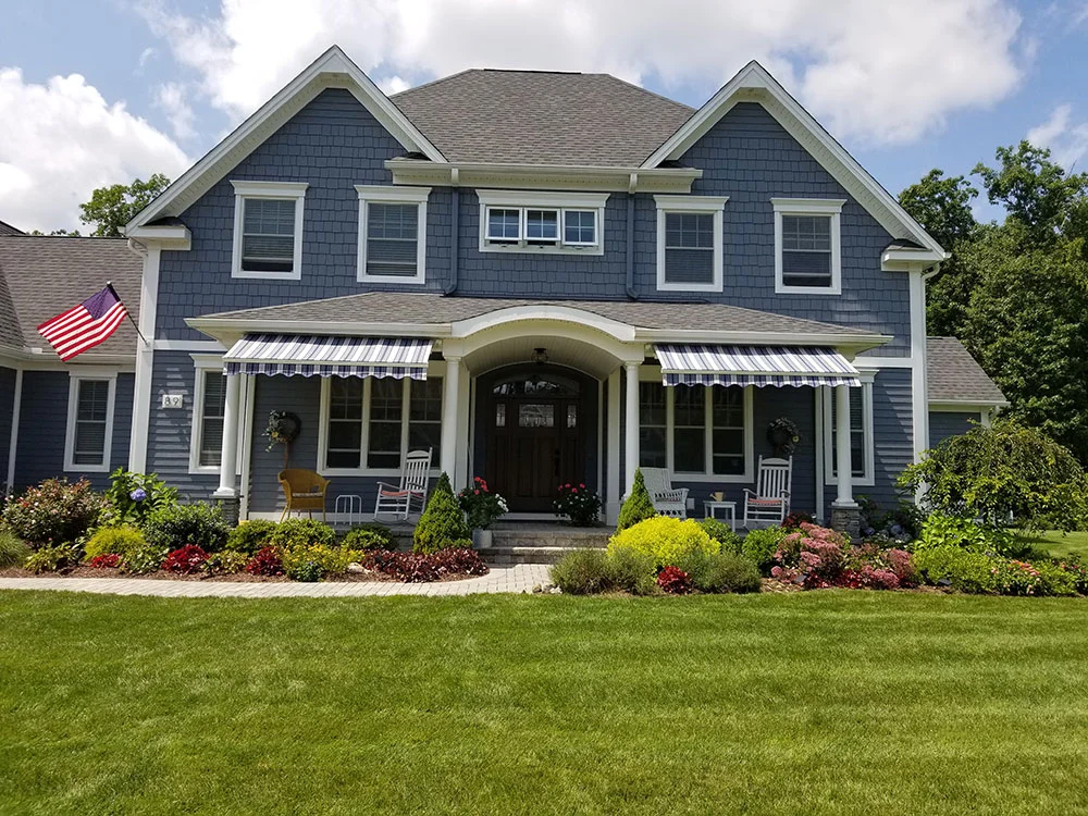 retractable awning installed on front of home