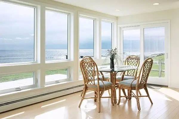 Majestic casement windows in a dining room with tables and chairs