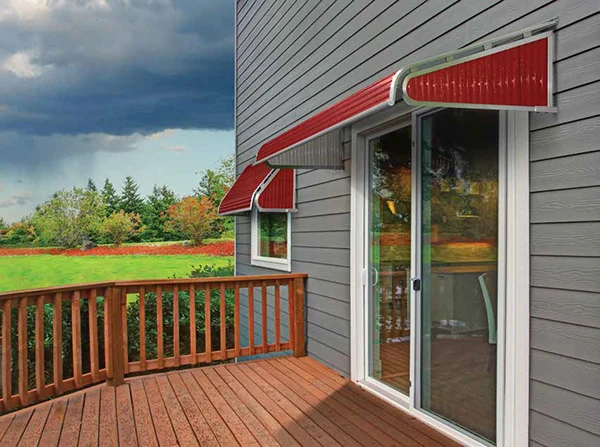 SummerSpace aluminum door and window canopy on a gray house