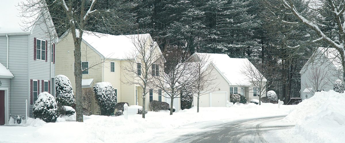 houses in residential community after snow in winter