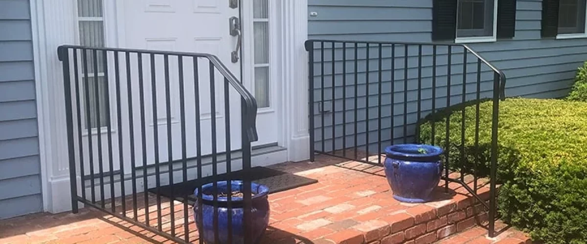 white entry door with side panels on a blue home in Connecticut