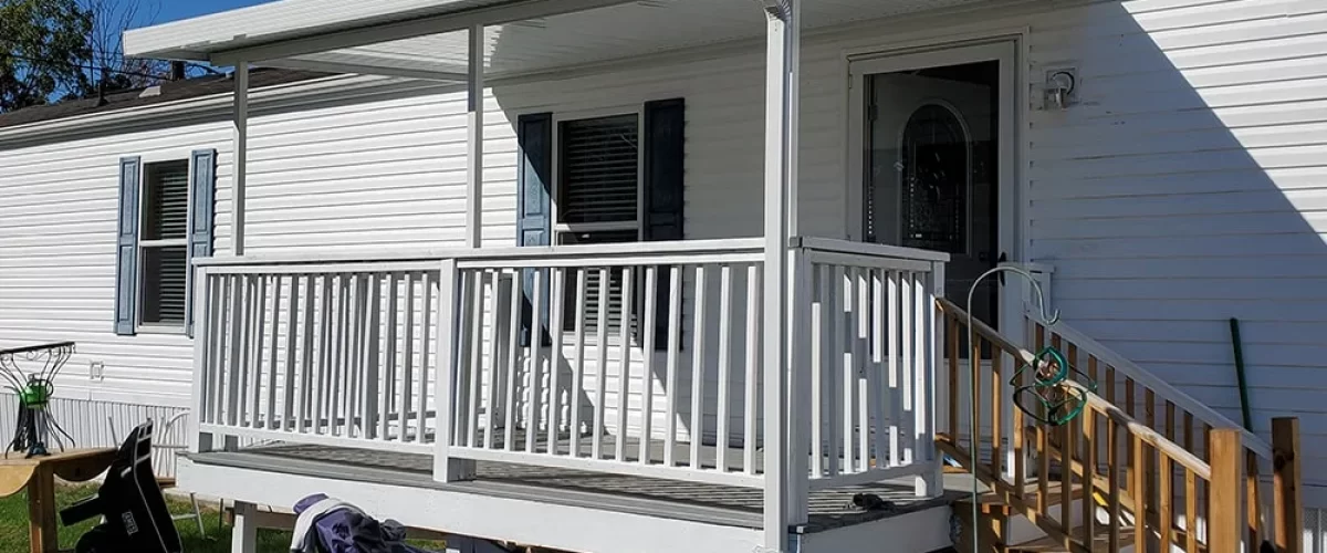 white aluminum patio cover installed on a trailer home