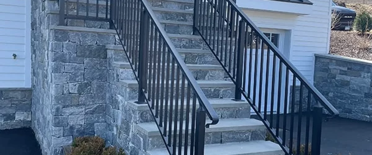 railing installed over a stone staircase