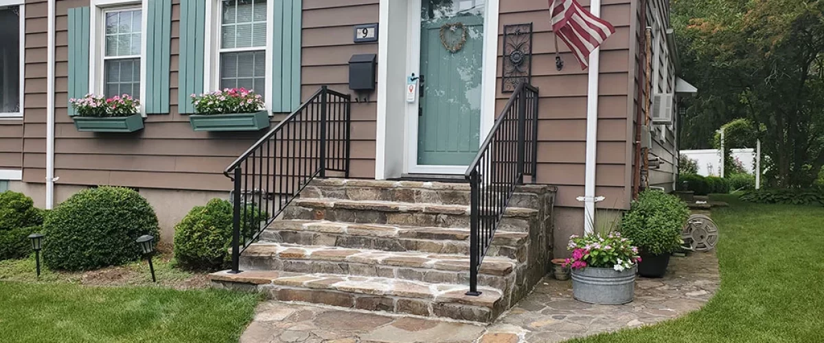 railing installation on stone porch