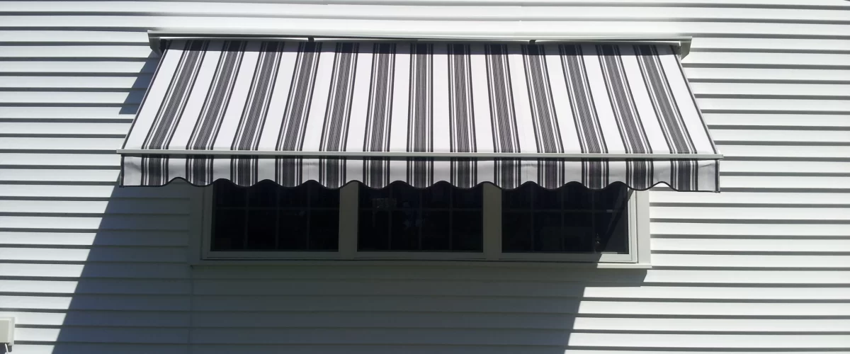 grey white striped retractable awning