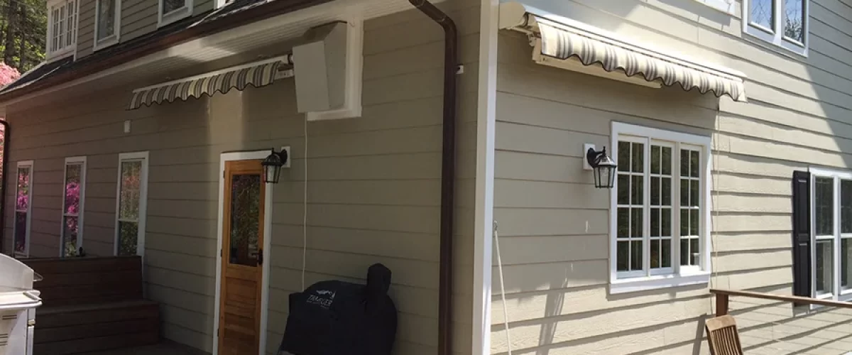 retractable awning on tan house