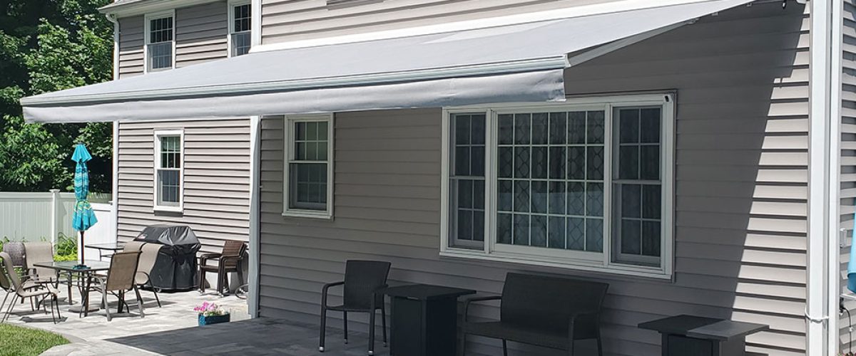 retractable awning on tan house