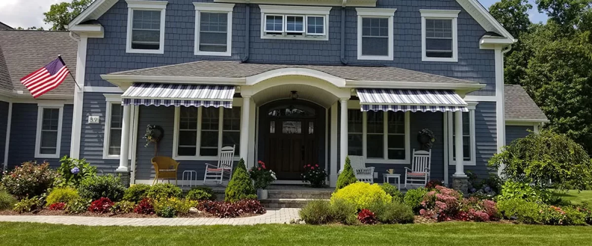 retractable awning installed on front of home