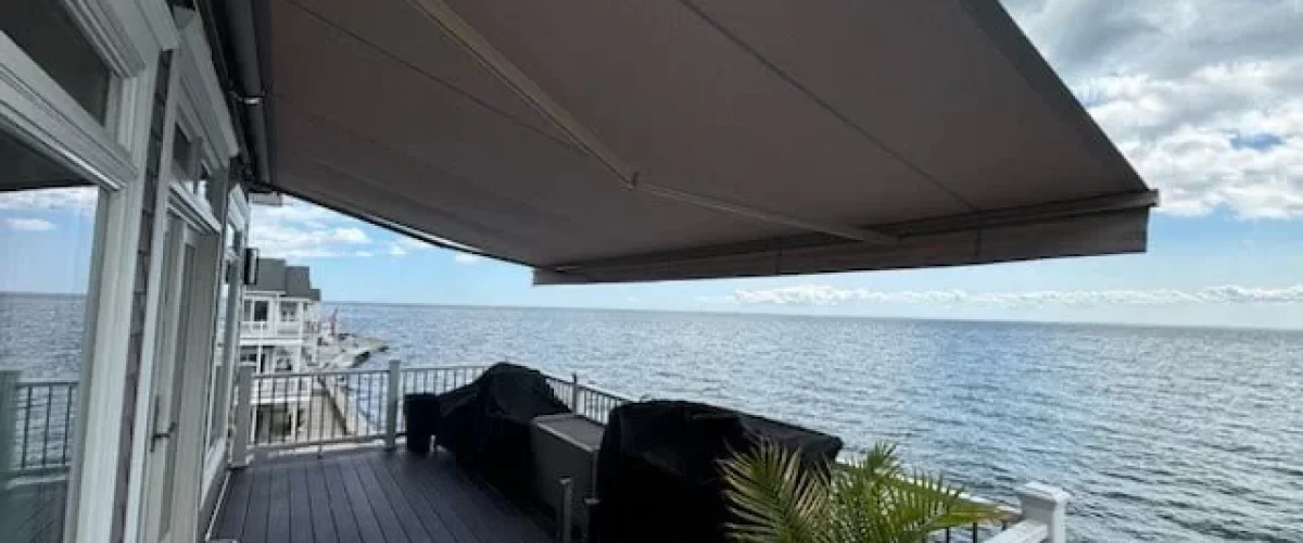 brown retractable awning covering a patio