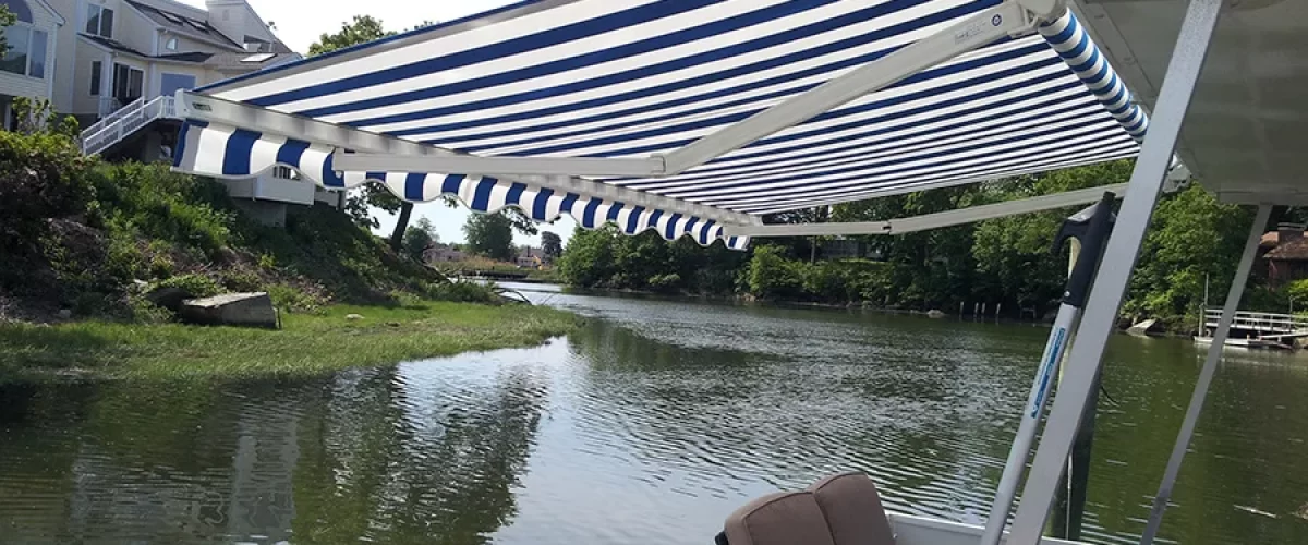 blue white striped retractable awning