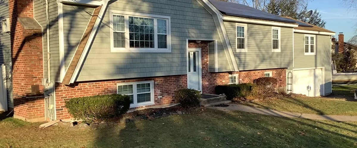 green vinyl siding installed on a home in Connecticut