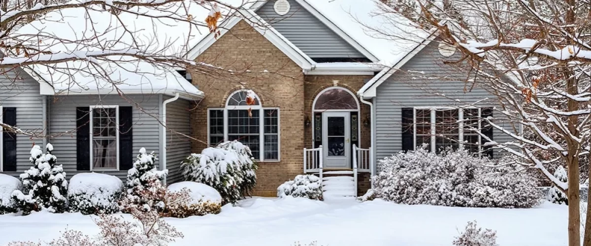 house surrounded by snow