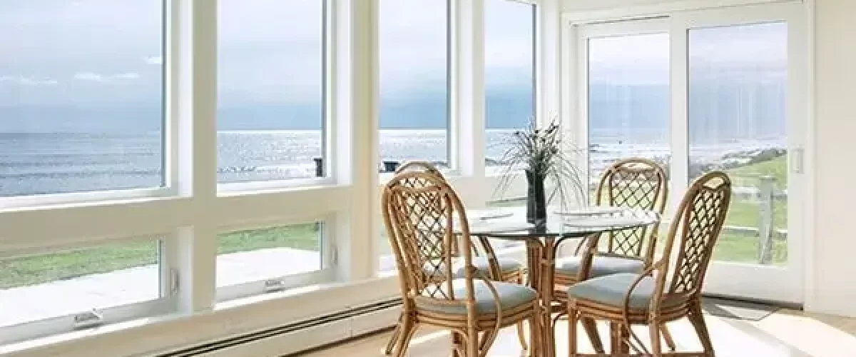 Majestic casement windows in a dining room with tables and chairs