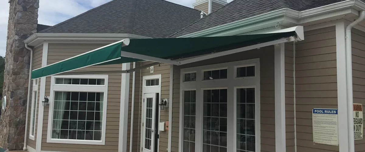 green retractable awning over outdoor area