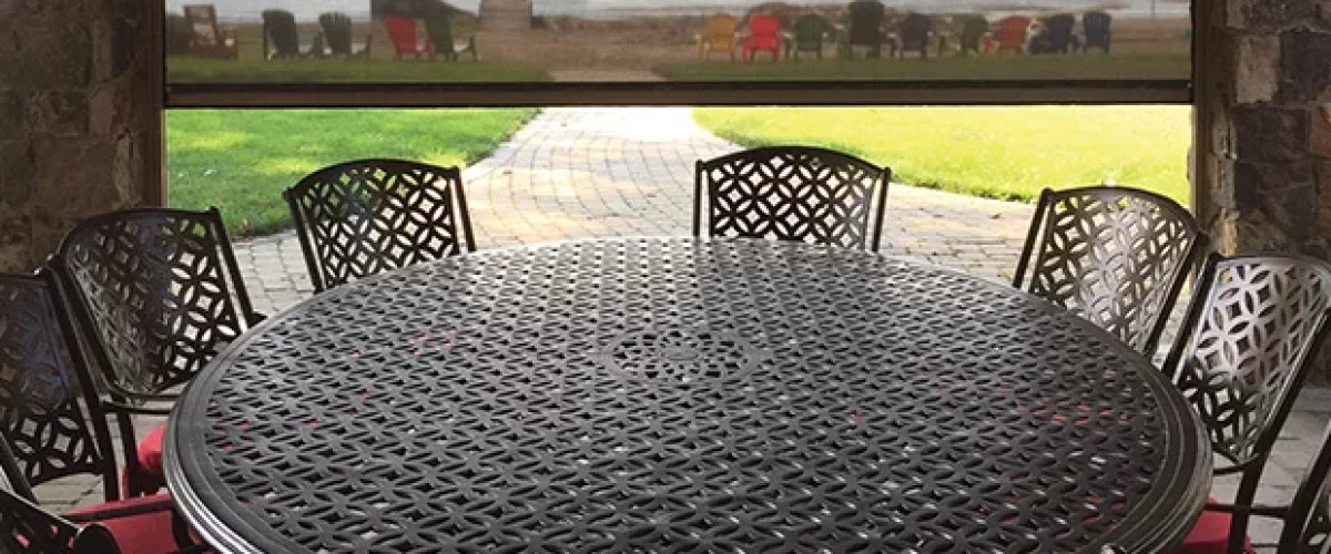 patio table with chairs under retractable awning